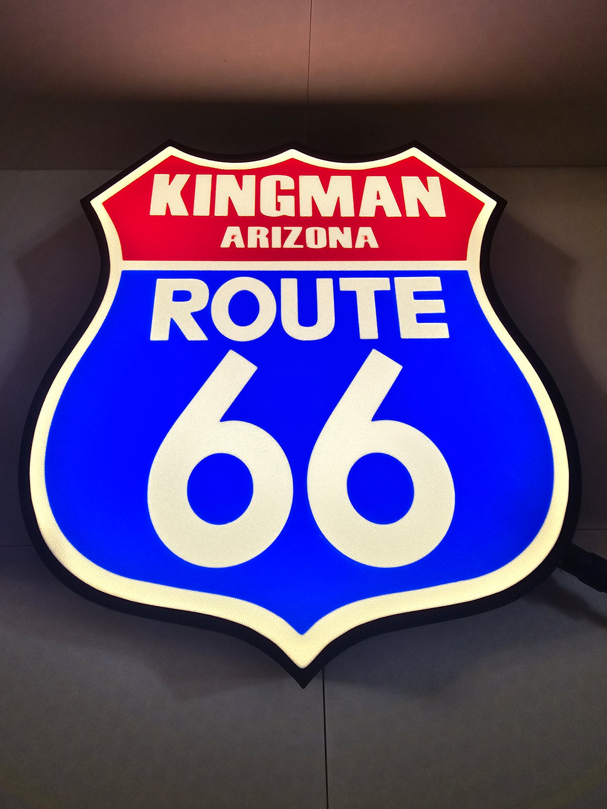 3D printed Route 66 lightbox sign featuring Kingman Arizona in red, blue, and white.