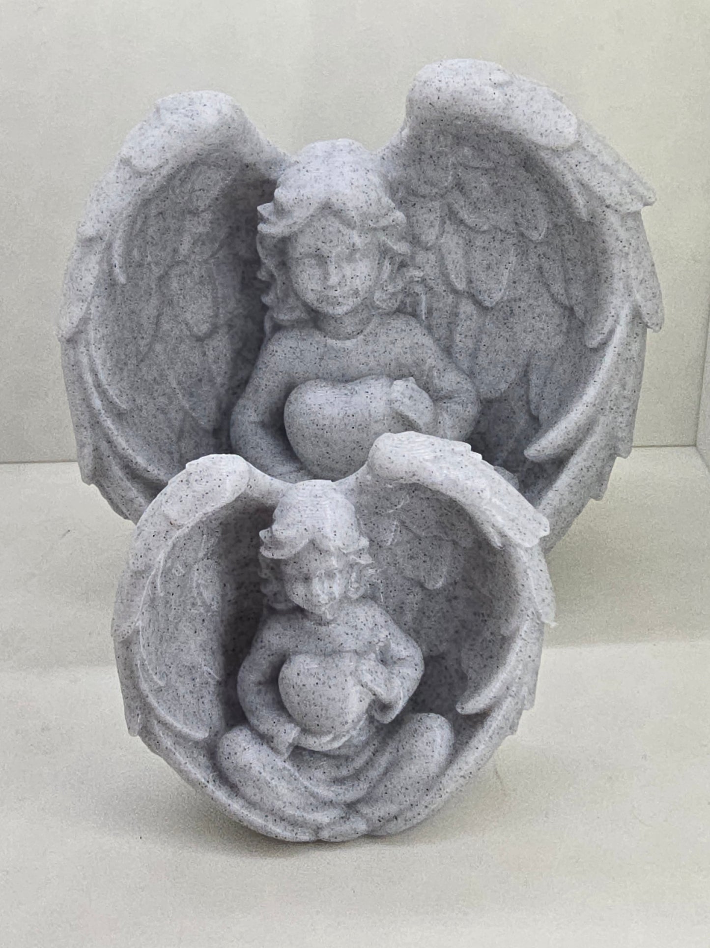 Angel with wings holding Heart Statue Small