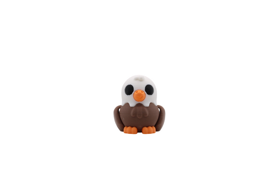 3D printed Eagle Flexi with a white head, brown body, and orange beak and feet.