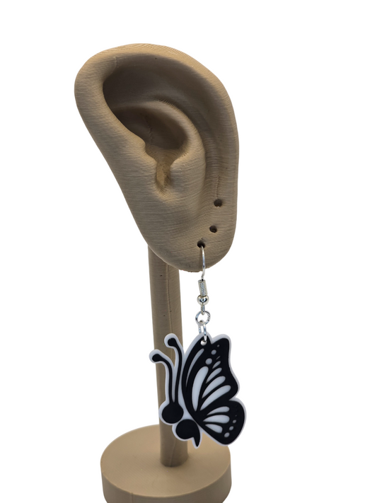 Butterfly-shaped earring on a 3d printed ear model