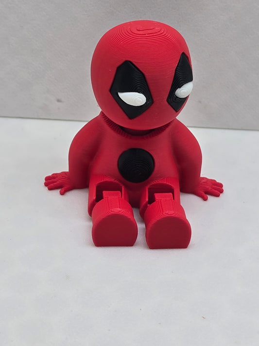 3D printed red and black Deadpool Buddy figure in a seated pose with bendable legs.