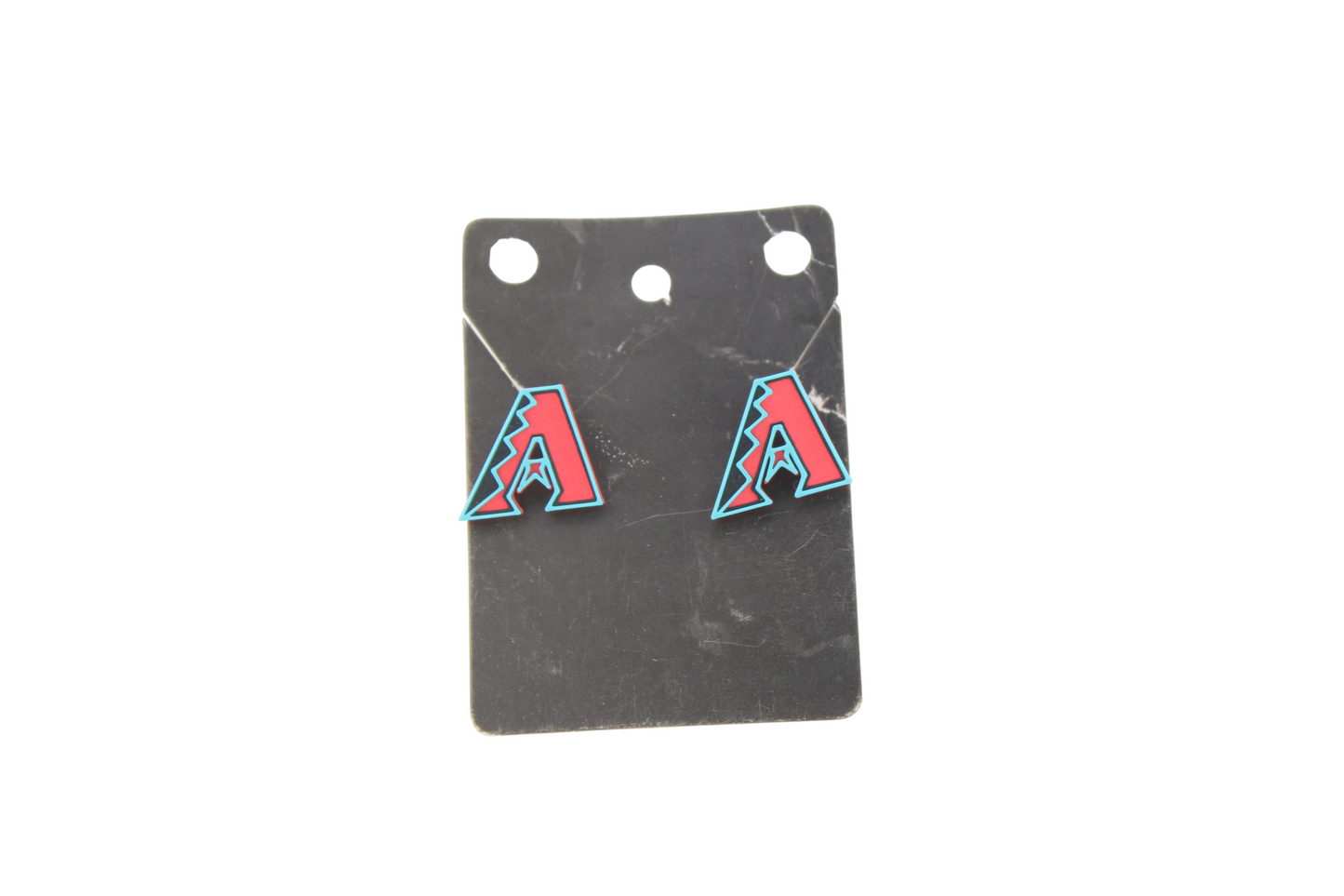 3D printed Arizona Diamondbacks logo stud earrings on a black marble display card.