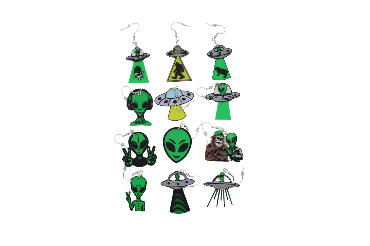 Collection of twelve unique 3D printed alien and UFO-themed earrings in green, black, and silver.