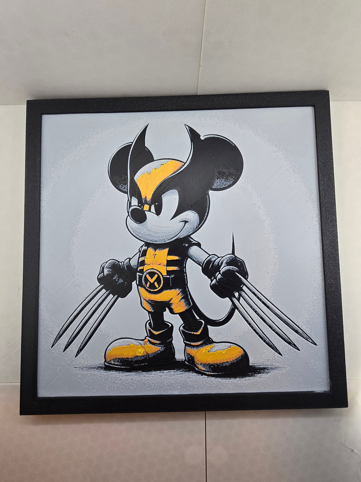 3D printed Mickey Wolverine Hueforge wall art in yellow, black, and white with a black frame.