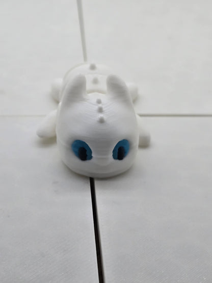 Small light fury dragon from how to train your dragon