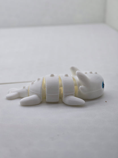 Small light fury dragon from how to train your dragon