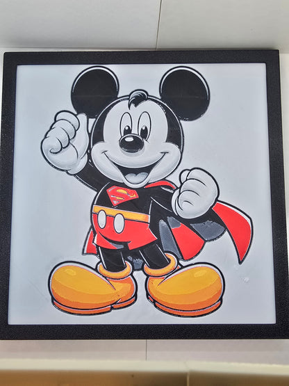 3D printed Mickey Superman Hueforge wall art in black, red, and yellow, framed in a black frame.