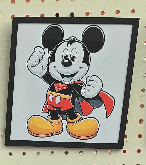 3D printed Mickey Superman Hueforge wall art in black, red, yellow, and white within a black frame.
