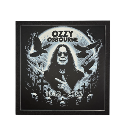Framed memorial painting for Ozzy Osbourne with crows, skulls, and cross symbols and birth and death years on a black background.
