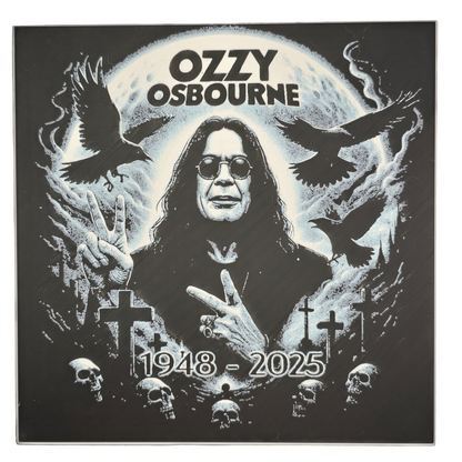 Framed memorial painting for Ozzy Osbourne with crows, skulls, and cross symbols and birth and death years on a black background.