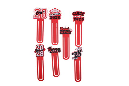 Seven red 3D printed Class of 2028 graduation bookmarks in various styles with page clip bodies.