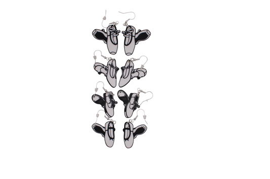 Four pairs of 3D printed dance shoe dangle earrings in pointe, stage, tap, and ballet styles.