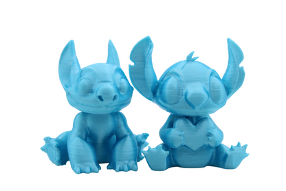 Stitch and Stitch Holding Heart Statues