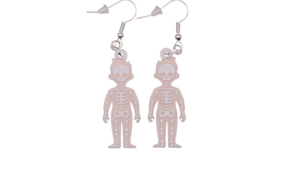 Two small beige skeleton earrings with white layered bone details, shown side by side on silver hooks.