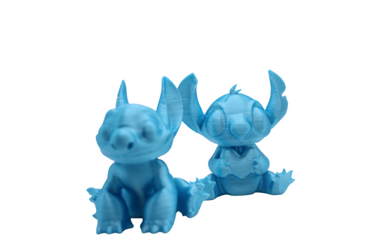 Stitch and Stitch Holding Heart Statues