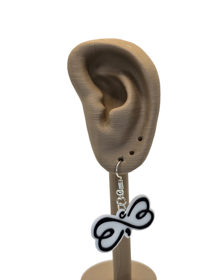 Earring displayed on a 3d printed ear model with a white background