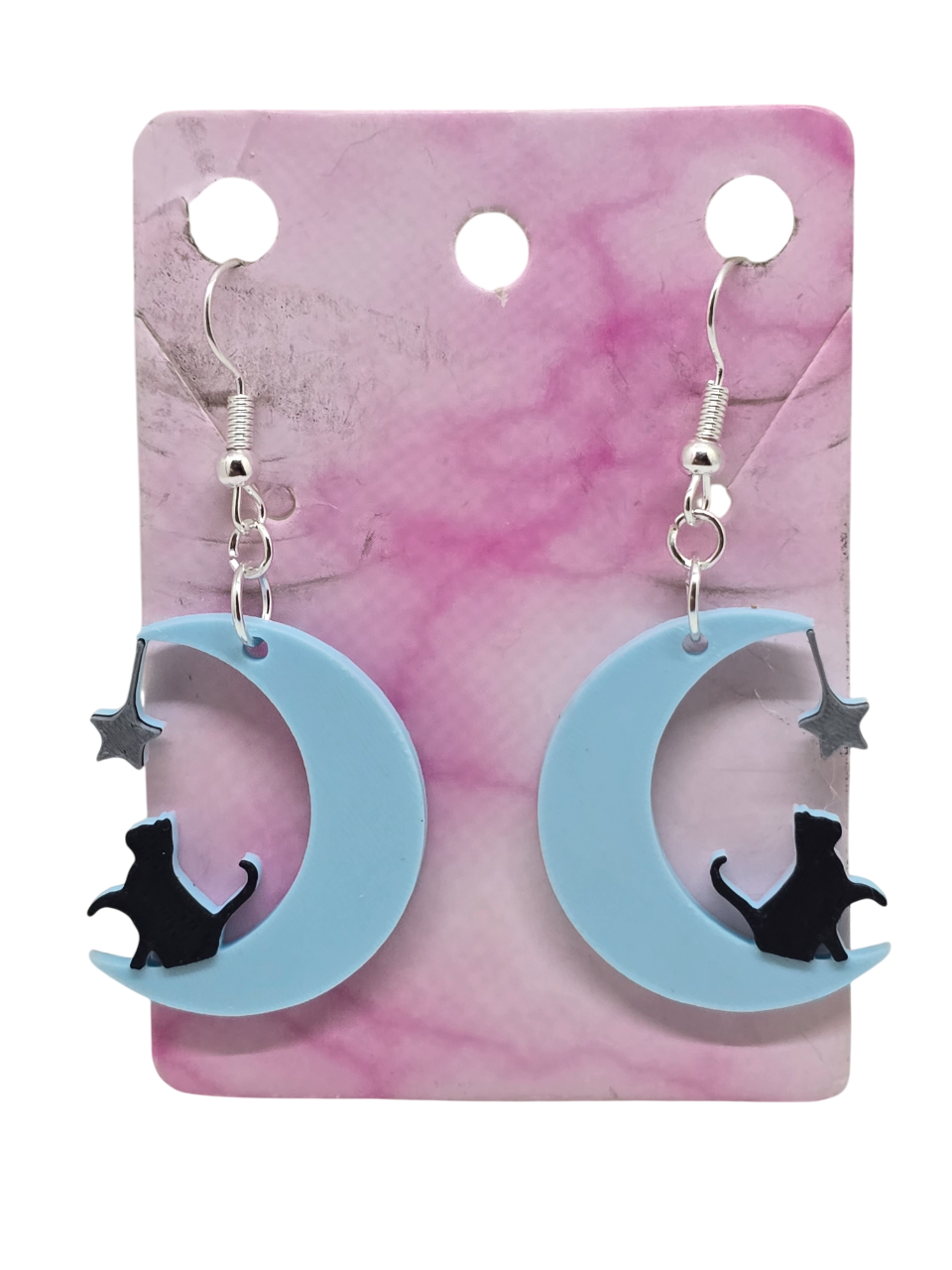 3D printed earrings featuring a black cat sitting on a light blue crescent moon with a silver star.