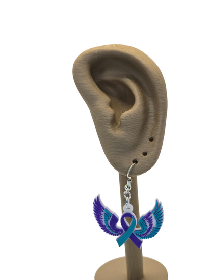 Earring displayed on a mannequin ear with a white background