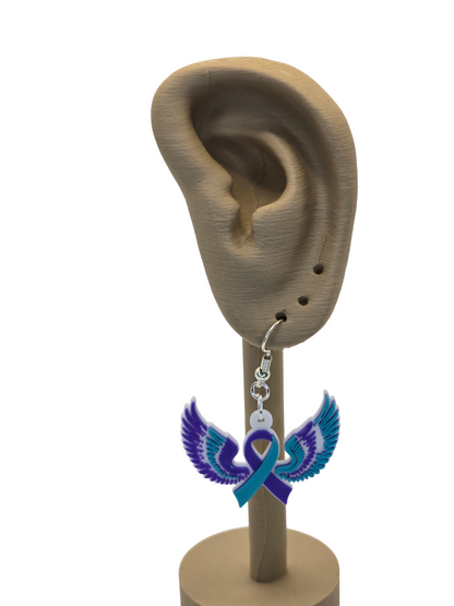 Earring with blue ribbon and purple wings displayed on an ear model.