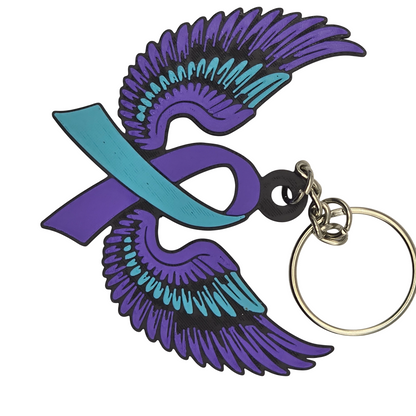 Keychain with teal and purple wings and a teal and purple ribbon on a white background