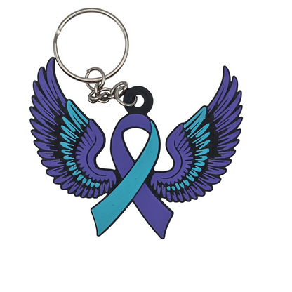 Keychain with teal and purple wings and a teal and purple ribbon on a white background