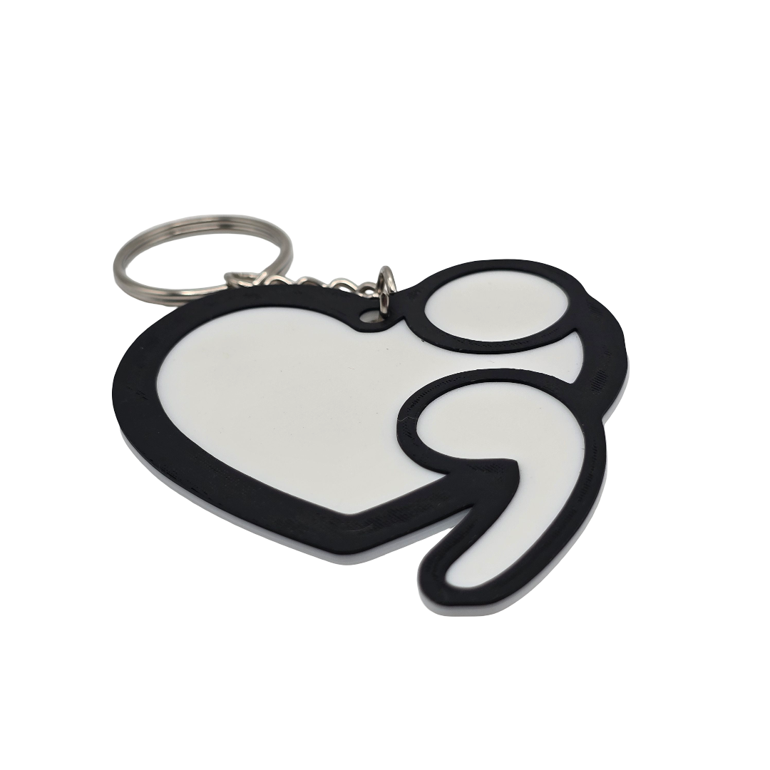 Heart-shaped keychain with a black outline on a white background