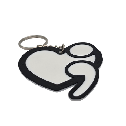 Heart-shaped keychain with a black outline on a white background