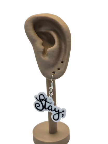 Earring with 'Stay ;' charm on a 3d printed ear model