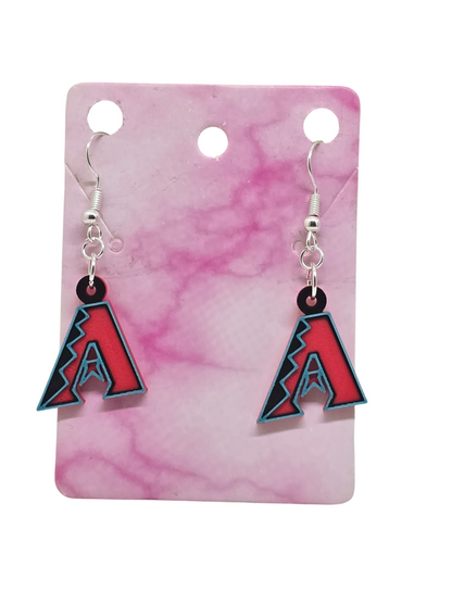 Small 3D printed Arizona Diamondbacks logo dangle earrings with black, red, and teal accents on a pink marble display card.