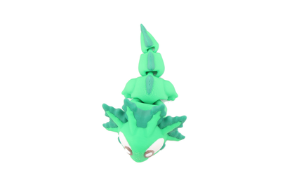 Top-down view of the 3D printed green flexi axolotl showing its full articulated body from gills to tail fin