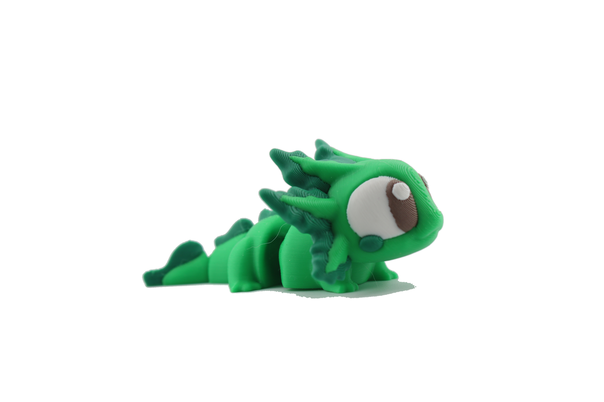 Side profile of the 3D printed green axolotl fidget figurine stretched out, showing its segmented flexi body and tail fin, made by Erratically Eccentric Creations
