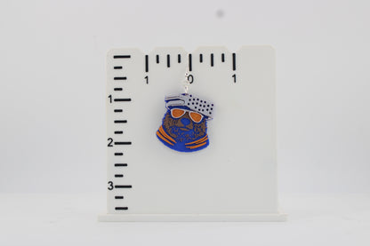 3D printed Chicago Bears bear head earring photographed next to a ruler showing approx. 2 inch height for size reference.