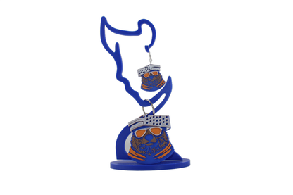 3D printed Chicago Bears bear head earrings displayed on a blue earring stand, showcasing the full design from Erratically Eccentric Creations.