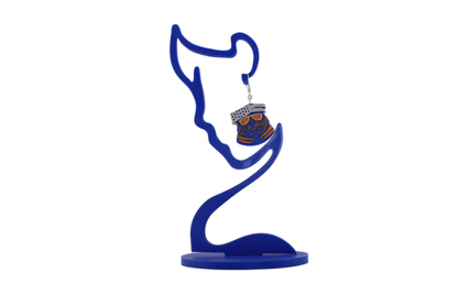 Lone 3D printed bear head earring on a blue display stand — Chicago Bears colors with orange sunglasses.