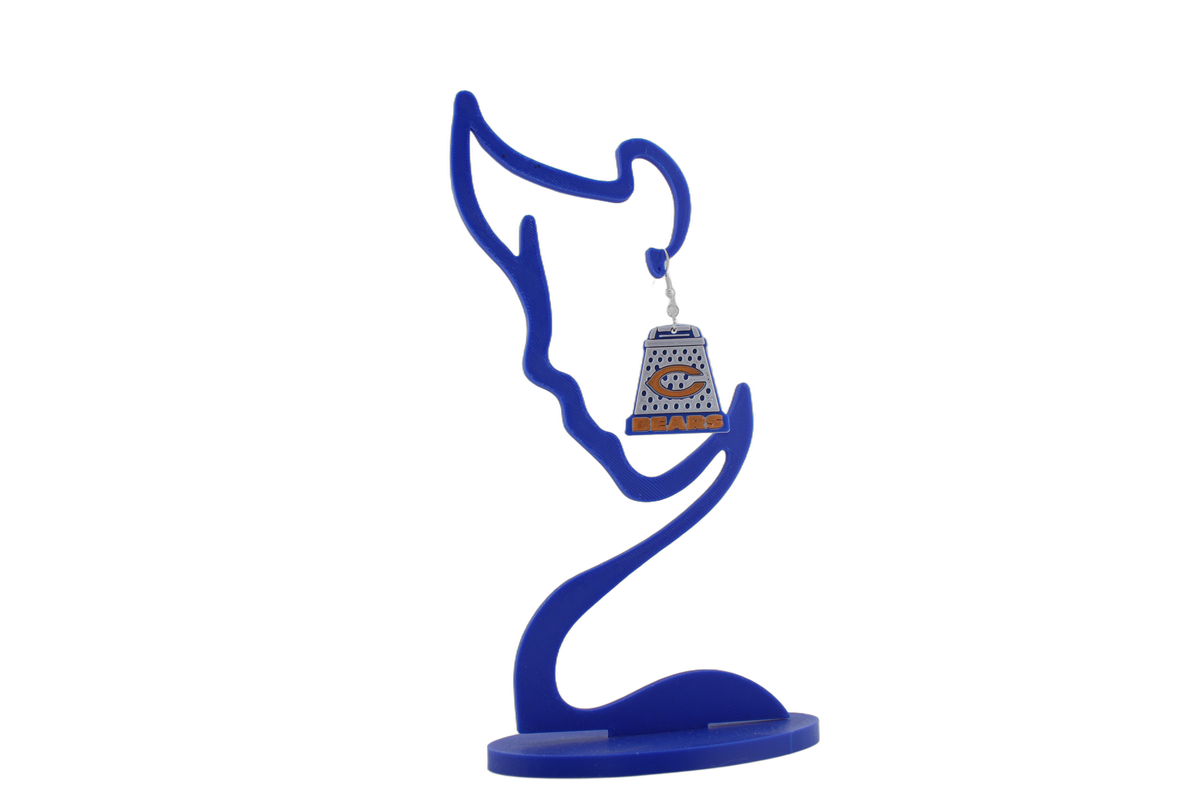 Single 3D printed cheese grater earring on blue stand — Bears blue and white with orange C logo.