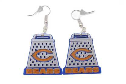 Pair of large 3D printed Chicago Bears cheese grater earrings with prominent orange C logos and BEARS lettering at the base.