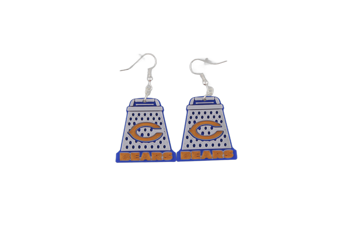 Dainty pair of 3D printed Chicago Bears cheese grater earrings in blue, white, and orange.