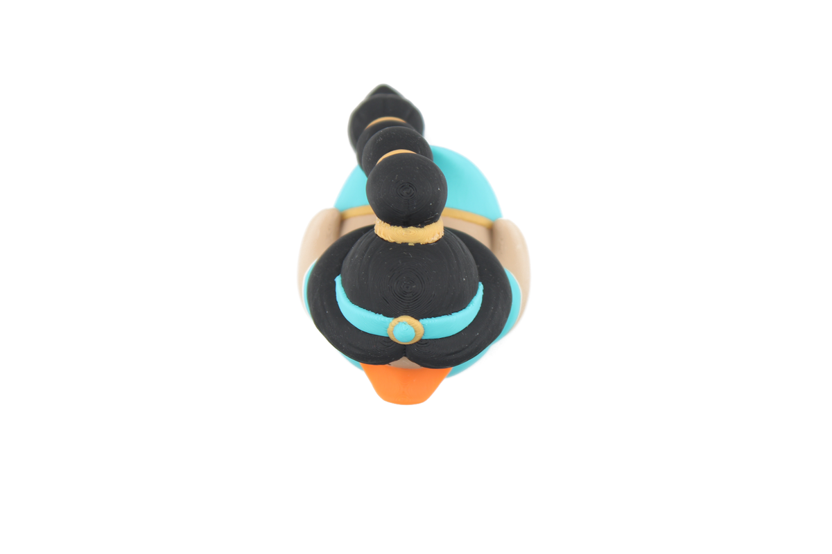 Top-down view of the 3D printed Jasmine duck showing her black hair, teal headband with gold jewel and orange bill