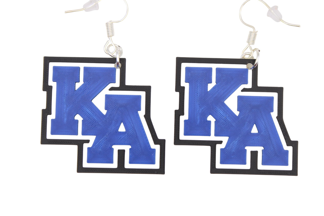 Pair of earrings with 'KA' letters on a white background