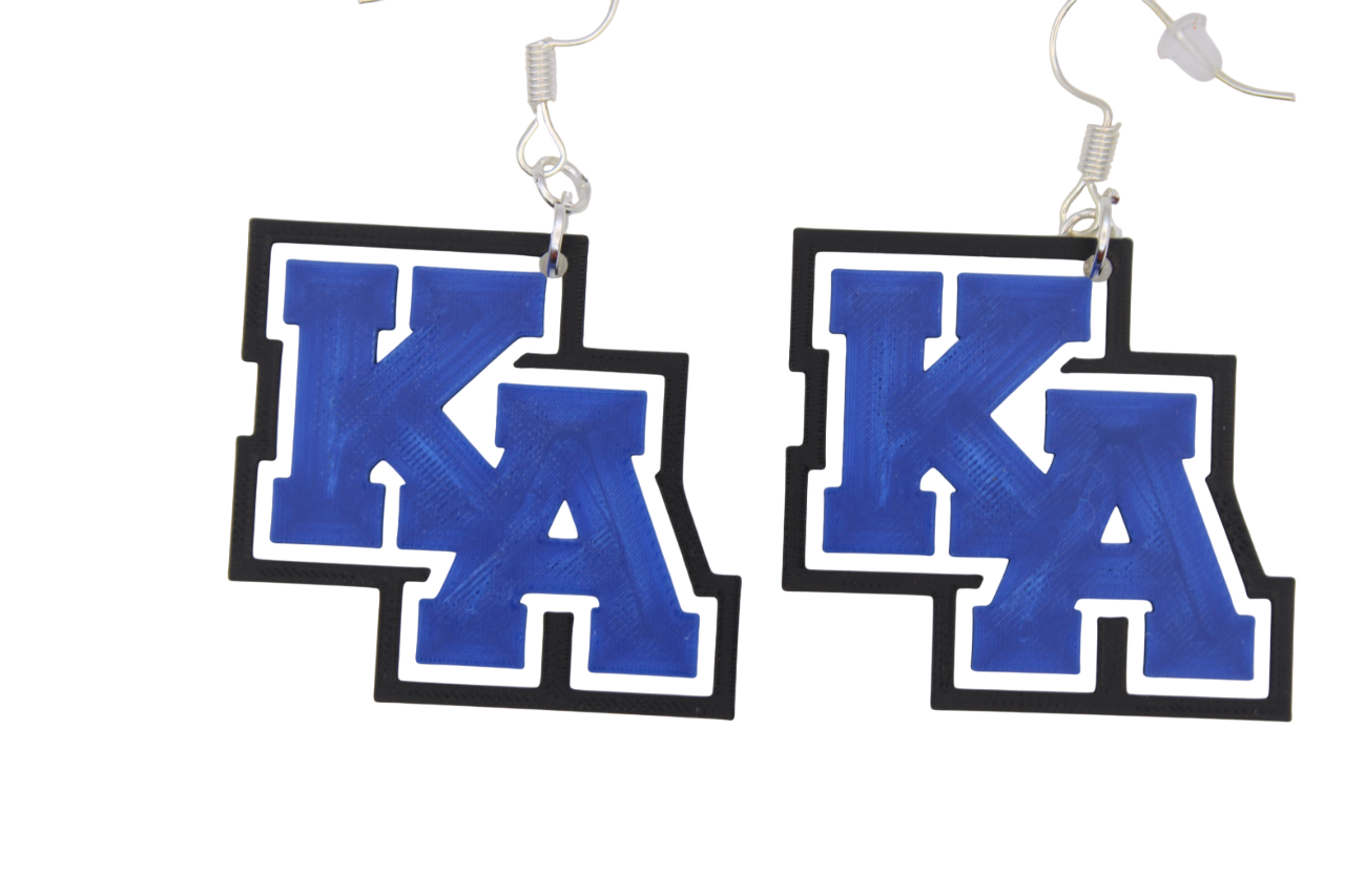 Pair of earrings with 'KA' letters on a white background
