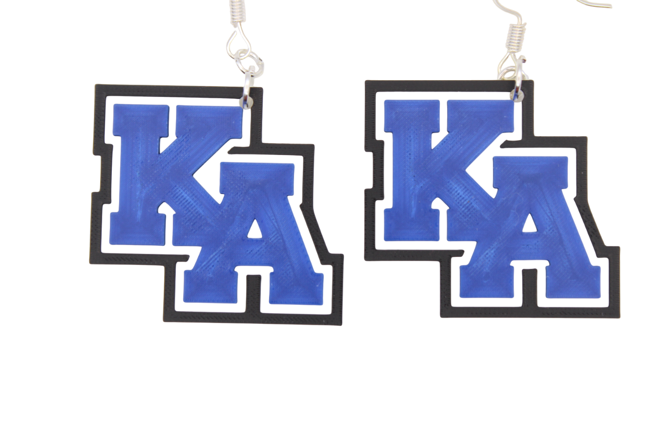 Pair of earrings with blue 'KA' letters on a white background