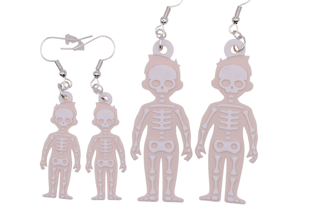 Four skeleton figure earrings in two sizes with cartoon bone details and metal hooks displayed side by side.