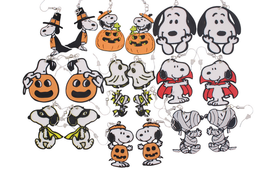 Ten pairs of 3D printed Peanuts Halloween earrings featuring Snoopy and Woodstock in costumes.