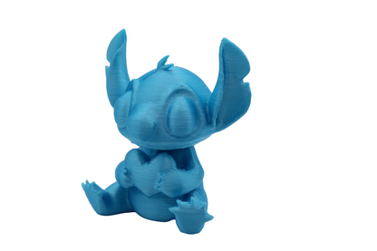 Stitch and Stitch Holding Heart Statues