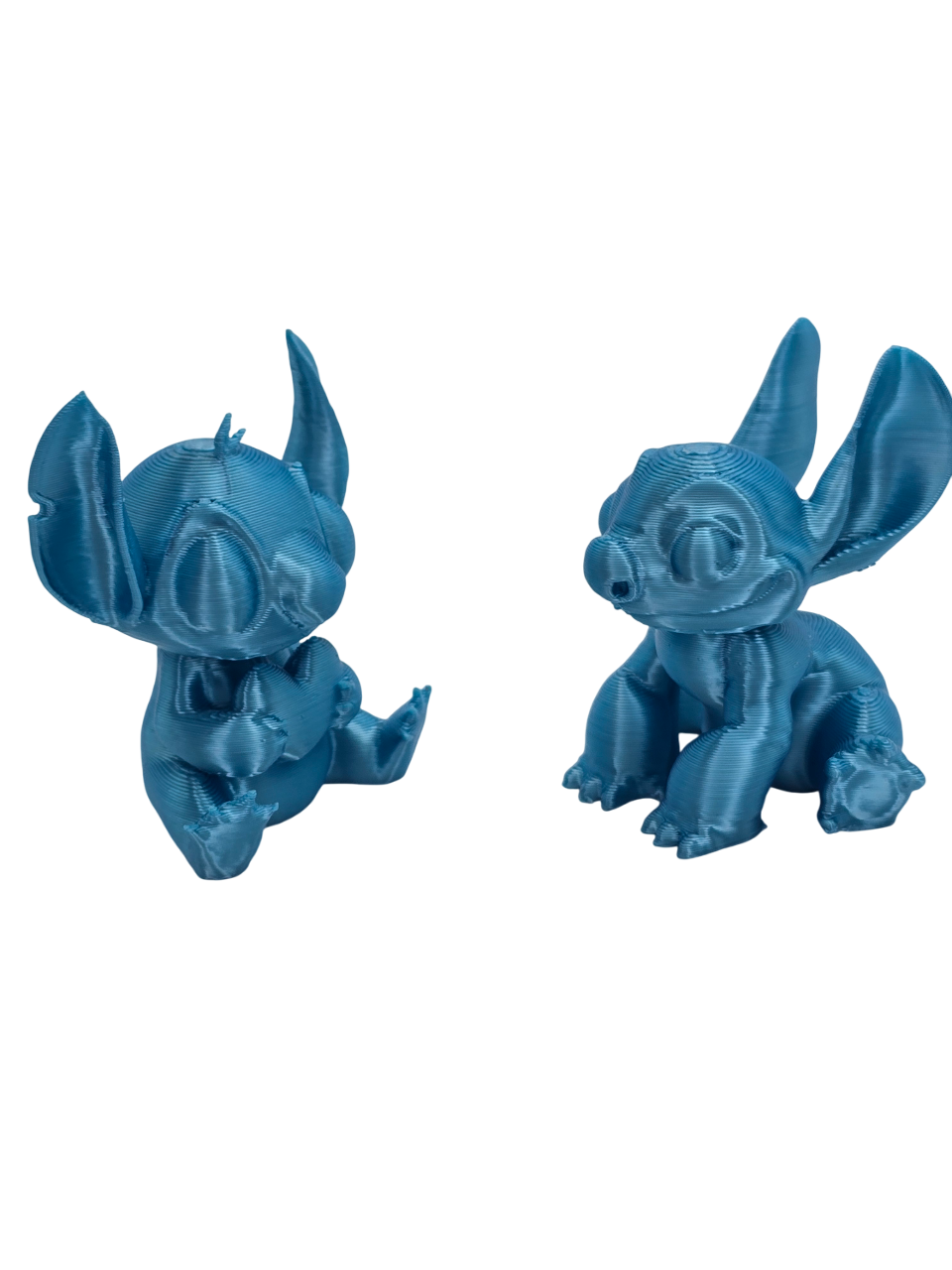 Stitch and Stitch Holding Heart Statues