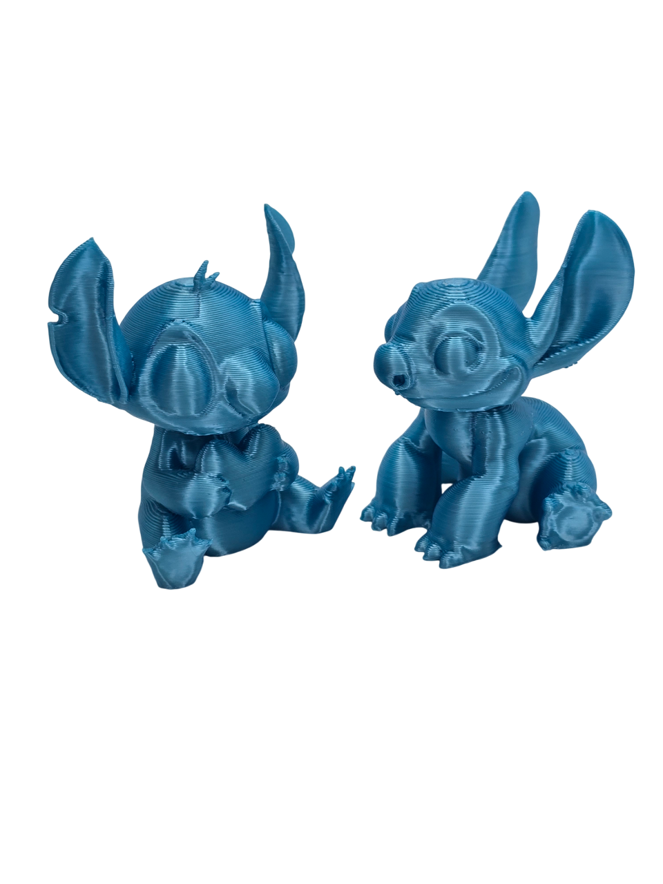 Stitch and Stitch Holding Heart Statues
